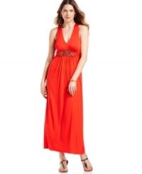 A fluid jersey dress from ECI captures the essence of tribal inspiration with its intricate beaded details. An exquisite drape and timeless maxi silhouette elevate the look to must-have status. A fluid jersey dress from ECI captures the essence of tribal inspiration with its intricate beaded details. An exquisite drape and timeless maxi silhouette elevate the look to must-have status.