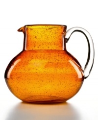 The eye-catching Iris pitcher makes a big impact in any setting with a rich amber hue and tiny bubbles trapped in dishwasher-safe glass. From Artland's serveware collection. The eye-catching Iris pitcher makes a big impact in any setting with a rich amber hue and tiny bubbles trapped in dishwasher-safe glass. From Artland's serveware collection.