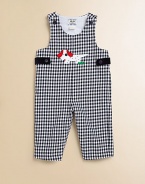 A charming one-piece in an overall design with a check pattern and puppy appliqué.ScoopneckShoulder straps with button closureSide buttonsBottom snaps65% cotton/35% rayonDry cleanImported Please note: Number of buttons and snaps may vary depending on size ordered. 