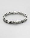 Small sterling silver bracelet in a squared, rope-weave pattern resembling herringbone, with push-lock closure.Sterling silverAbout 3 diam.Imported