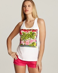 A racerback tank top with palm tree print and beading detail on front.