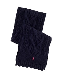 Rendered in hearty cotton for comfortable warmth, a classic cabled scarf is trimmed with ruffled pointelle edges for a pretty finish. Rendered in hearty cotton for comfortable warmth, a classic cabled scarf is trimmed with ruffled pointelle edges for a pretty finish.