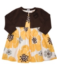 Put her in a new spin on floral with this neutral but lively dress and cardigan set from Carter's. Put her in a new spin on floral with this neutral but lively dress and cardigan set from Carter's.