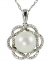 Elegance is always in season, just like this sterling silver necklace which features a cultured freshwater pearl (9-10 mm) and round-cut diamond (1/10 ct. t.w.) flower pendant. Approximate length: 18 inches. Approximate drop length: 7/8 inch. Approximate drop width: 5/8 inch.