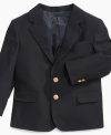 He'll stand out with the sharp style of this brass-button blazer from Izod.