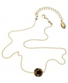 What to wear when you're on the prowl. GUESS's glistening fireball features a fierce leopard print in black epoxy and light Colorado topaz stones. Strung from a gold tone mixed metal chain. Approximate length: 16 inches + 2-inch extender. Approximate drop: 1/4 inch.