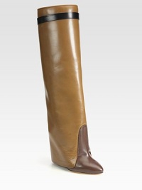 Sleek multicolored boot of supple leather, with a unique fold-over cuff and hidden lacquered wedge. Lacquered wedge with covered leather flap, 6 (150mm)Shaft, 19¾Leg circumference, 13½Leather upperPull-on styleLeather lining and solePadded insoleMade in Italy Sleek multicolored boot of supple leather, with a unique fold-over cuff and hidden lacquered wedge. Lacquered wedge with covered leather flap, 6 (150mm)Shaft, 19¾Leg circumference, 13½Leather upperPull-on styleLeather lining and solePadded insoleMade in Italy