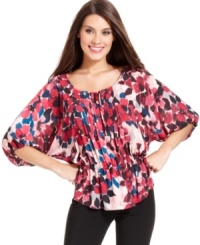 Alfani's pretty peasant top glows with a vibrant floral print and special details, like a pleated front placket. (Clearance)
