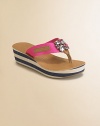 Attractively striped wedge and platform topped with a sparking embellishment in a low-cut thong silhouette.Slip-on styleNylon upperRubber soleImported