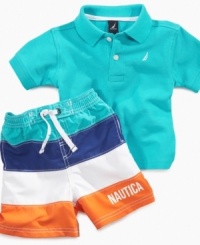 Sail on through in style. He'll get through the day comfortably in this cute polo and swim trunk set from Nautica. Sail on through in style. He'll get through the day comfortably in this cute polo and swim trunk set from Nautica.