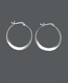 An intriquing twist on a traditional pair of hoops, these sterling silver twist hoop earrings by Unwritten are an instant classic. Approximate diameter: 1 inch.