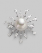 A shiny starburst with lustrous pearl center radiates with glimmering rhinestone rays. 14mm round white pearl Cubic zirconia Sterling silver Diameter, about 1½ Pin backing Made in Spain 