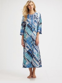 Lightweight charmeuse skims the body in an effortless caftan pullover.JewelneckZip placketThree-quarter sleevesAbout 53 from shoulder to hemPolyesterMachine washImported Lightweight charmeuse skims the body in an effortless caftan pullover.JewelneckZip placketThree-quarter sleevesAbout 53 from shoulder to hemPolyesterMachine washImported
