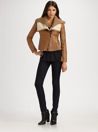 A closely-cropped silhouette of rich leather, finished with lush shearling trim and a removable knit collar.Genuine natural shearling collar with removable knit layerAsymmetrical front zipperWelt pocketsWool knit panelsAbout 20 from shoulder to hemLeather body; wool/acrylic panelsDry clean by a leather specialistImportedFur origin: UruguayPlease note: Due to the natural nature of the shearling A closely-cropped silhouette of rich leather, finished with lush shearling trim and a removable knit collar.Genuine natural shearling collar with removable knit layerAsymmetrical front zipperWelt pocketsWool knit panelsAbout 20 from shoulder to hemLeather body; wool/acrylic panelsDry clean by a leather specialistImportedFur origin: UruguayPlease note: Due to the natural nature of the shearling