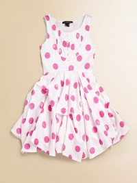 Pretty polka dots and a ruffled full skirt with pick up details will make her feel like the belle of the ball.ScoopneckSleevelessPullover styleFront bib with button detailFull skirtUneven hemCottonHand washImported Pretty polka dots and a ruffled full skirt with pick up details will make her feel like the belle of the ball.ScoopneckSleevelessPullover styleFront bib with button detailFull skirtUneven hemCottonHand washImported