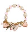 Charm your heart. Betsey Johnson's bracelet highlights pink faceted beads and glass pearls on a half-stretch chain. Bracelet is decorated with pink-colored lucite hearts with crystal accents, gold tone bow with pink-colored crystal accent and round crystal disc. Set in gold tone mixed metal. Approximate length: 7-1/2 inches.