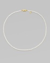 A single strand of luminous pearls with signature clasp closure.4mm white cultured pearls 18K yellow gold Length, about 16 Minuette clasp closure Imported 