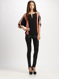 Bold colorblock adds graphic appeal to this draped hi-lo hem top.Split v-neckDropped shouldersRoll-tab dolman sleevesHi-lo hemPolyesterDry cleanImportedModel shown is 5'11 (180cm) wearing US size Small. Bold colorblock adds graphic appeal to this draped hi-lo hem top.Split v-neckDropped shouldersRoll-tab dolman sleevesHi-lo hemPolyesterDry cleanImportedModel shown is 5'11 (180cm) wearing US size Small.