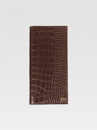 A travel essential crafted of crocodile-embossed Italian calfskin, this handsome design has a ticket compartment, six credit card slots and one slot for passport. Keeps all travel papers organized and handy About 3½ X 9¼ Made in USAFOR PERSONALIZATIONSelect a color and quantity, then scroll down and click on PERSONALIZE & ADD TO BAG to choose and preview your personalization options. Please allow 1 week for delivery.