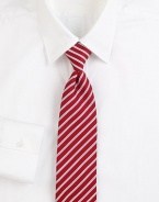 Some things are timeless, and this classic tie, woven in Italian silk with contrast stripes, is one of them. About 3 wideSilkDry cleanMade in Italy