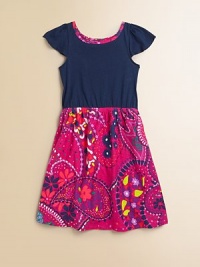 A tropical floral pattern enlivens this classic silhouette, shaped with a pretty gathered waist and flounced cap sleeves.JewelneckFlounced sleevesElasticized waistFull skirtPull-on styleCottonMachine washImported A tropical floral pattern enlivens this classic silhouette, shaped with a pretty gathered waist and flounced cap sleeves.JewelneckFlounced sleevesElasticized waistFull skirtPull-on styleCottonMachine washImported