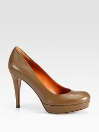 Leather staple with a slight platform and rounded toe. Self-covered heel, 4¼ (110mm)Self-covered platform, ¾ (20mm)Compares to a 3½ heel (90mm)Leather upperRound toeLeather lining and soleRubber trek soleMade in ItalyOUR FIT MODEL RECOMMENDS ordering true size. Leather staple with a slight platform and rounded toe. Self-covered heel, 4¼ (110mm)Self-covered platform, ¾ (20mm)Compares to a 3½ heel (90mm)Leather upperRound toeLeather lining and soleRubber trek soleMade in ItalyOUR FIT MODEL RECOMMENDS ordering true size.