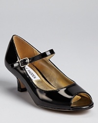 An elegant first heel for your little fashionista, this patent leather pump has a comfy buckle strap closure and peak toe. An elegant first heel for your little fashionista, this patent leather pump has a comfy buckle strap closure and peak toe.