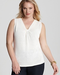 Work feminine flair into your daily repertoire with this Jones New York Collection tank that flaunts an elegant knotted neckline. Slip the style under sleek blazers or cropped cardigans for a chic finish. Work feminine flair into your daily repertoire with this Jones New York Collection tank that flaunts an elegant knotted neckline. Slip the style under sleek blazers or cropped cardigans for a chic finish.
