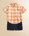 A perfect preppy pairing for the warmer weather, this classic ensemble features a plaid shirt