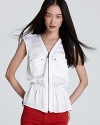A bullish front zip and gleaming gold accents lend military inspiration to this MICHAEL Michael Kors white shirt. Play up the peplum hem with colored denim for a commanding casual look.
