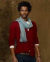 Mended with colorful patterned patches, a V-neck wool cardigan blends a handsome silhouette with an electic vibe for your unique style.