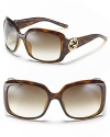 Chic rectangle sunglasses with Gucci's new logo at temples.