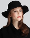 An elegant felt floppy hat with a feather band from August Accessories.