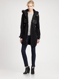 Versatile parka with a fox fur collar and inner removable rabbit fur vest for added warmth. Versatile parka with a fox fur collar and inner removable rabbit fur vest for added warmth.