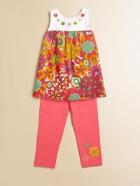 Groovy embroidered flowers and bold hues adorn this head-turning, empire-waist tunic for a 70's-inspired feel.ScoopneckSleevelessBack buttonsGathered empire waist95% cotton/5% spandexMachine washImported Please note: Number of buttons may vary depending on size ordered. Groovy embroidered flowers and bold hues adorn this head-turning, empire-waist tunic for a 70's-inspired feel.ScoopneckSleevelessBack buttonsGathered empire waist95% cotton/5% spandexMachine washImported Please note: Number of buttons may vary depending on size ordered.