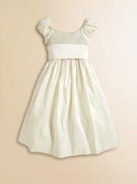 Intricate smocking gives a timeless heirloom charm to our cap-sleeved party dress, crafted from lustrous silk taffeta with a full crinoline-lined skirt and pretty sash.ScoopneckCap sleevesBack buttonsSmocked bodiceEmpire waist with tie sashRuffled and crinoline-lined petticoatSilk taffetaDry cleanImported Please note: Number of buttons may vary depending on size ordered. Intricate smocking gives a timeless heirloom charm to our cap-sleeved party dress, crafted from lustrous silk taffeta with a full crinoline-lined skirt and pretty sash.ScoopneckCap sleevesBack buttonsSmocked bodiceEmpire waist with tie sashRuffled and crinoline-lined petticoatSilk taffetaDry cleanImported Please note: Number of buttons may vary depending on size ordered.