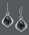 Perfect for the stylish professional - these elegant drop earrings transition effortlessly from office to evening. A unique, teardrop setting highlights polished black onyx drops (7 mm). Set in sterling silver. Approximate drop: 1-3/4 inches.