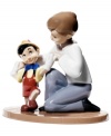 Pinocchio takes his first steps to becoming a real boy in this collectible figurine inspired by the Disney classic. Handmade in Nao by Lladro porcelain.