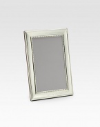 Classic and sophisticated in groove-trimmed sterling silver. From the Grooves CollectionFits vertical photographsMade in SpainDIMENSION INFORMATION4 X 6 (5 X 7 overall)5 X 7 (7 X 9 overall)8 X 10 (10 X 12 overall)FOR PERSONALIZATIONSelect a quantity, then scroll down and click on PERSONALIZE & ADD TO BAG to choose and preview your monogramming options. Please allow 2 weeks for delivery.