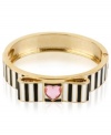 What's black and white and raved all over? This bracelet from Betsey Johnson, which is crafted from antique gold-tone mixed metal with a bow, stripes and a heart-shaped crystal accent for a whimsical touch. Item comes packaged in a signature Betsey Johnson Gift Box. Approximate diameter: 2-1/2 inches.