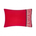 Josie Natori once again brings Eastern art to Western life with Geisha. A profusion of Geisha Red contrasting against Natori Black evokes a feeling of rich mystery. The his and her Geisha and Samurai Euros feature hints of pearly shoulders and necks, contrasted with jet-black chignons and red kimono accents. Embroidery on the Euros is of fine silky yarn on a dramatically contrasting ground of Khaki cotton. Further evoking Eastern art in the form of a samurai sword, the obi quilting pattern uses golden threads on the Geisha Red coverlet which creates a modern geometric texture with an embroidered border.