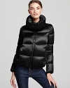 In an ultra soft, satin nylon, this plush and pillowy Moncler coat is a luxe investment for winter.