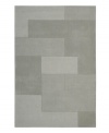 An abstract pattern makes a bold, modern statement upon this inviting Bowery area rug from Calvin Klein. Generously thick wool fibers are hand tufted in India for remarkable strength and detailed design.