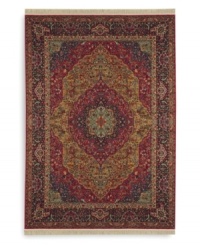 Inspired by the distinctive and beautiful textiles of the Kirman region in ancient Persia, this rug features a curvilinear medallion design upon a field embellished with arabesques and floral motifs. Patterned after a nineteenth-century Kirman rug, it makes use of borders to showcase a spectrum of colors such as indigo blue, brick reds, tobacco golds, browns and olives - with a smattering of soft aqua, coral and burgundy. Each color is specially dyed for a timeworn striated effect that recreates the antique beauty of the original. Woven in the USA of luxuriously soft premium worsted New Zealand wool. Inspired by the distinctive and beautiful textiles of the Kirman region in ancient Persia, this rug features a curvilinear medallion design upon a field embellished with arabesques and floral motifs. Patterned after a nineteenth-century Kirman rug, it makes use of borders to showcase a spectrum of colors such as indigo blue, brick reds, tobacco golds, browns and olives - with a smattering of soft aqua, coral and burgundy. Each color is specially dyed for a timeworn striated effect that recreates the antique beauty of the original. Woven in the USA of luxuriously soft premium worsted New Zealand wool.