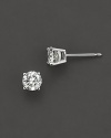 Traditional four prong round diamond stud earring in a white gold setting.