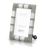 A unique metal frame with precious mother of pearl features a fully studded four corner embellishment with hundreds of handset Swarovski crystals. The back of the frame uses a combination of metal and enamel with large Swarovski studs. A unique metal frame with precious mother of pearl features a fully studded four corner embellishment with hundreds of handset Swarovski crystals. The back of the frame uses a combination of metal and enamel with large Swarovski studs.