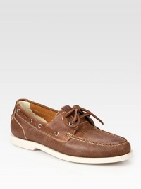 Traditional boat shoe style with contrast rubber sole and lace-up detail.Leather upperLeather liningPadded insoleRubber soleImported Traditional boat shoe style with contrast rubber sole and lace-up detail.Leather upperLeather liningPadded insoleRubber soleImported
