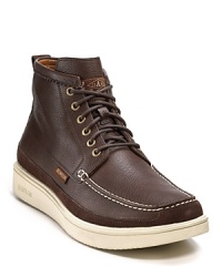 A handsomely rugged boot from Paul Smith rendered with a moc toe, contrast stitching and chunky contrast rubber sole. A handsomely rugged boot from Paul Smith rendered with a moc toe, contrast stitching and chunky contrast rubber sole.