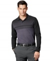 Stripes take this polo from basic to bold in this shirt from Van Heusen.