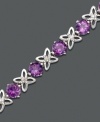 A gorgeous gift for a February birthday girl or a lover of violet. Round-cut amethyst (6-1/4 ct. t.w.) contrasts sweetly with diamond-accented X-shaped links. Bracelet crafted in sterling silver. Approximate length: 7 inches.